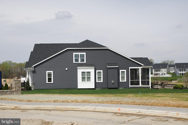 view of front facade with a sunroom