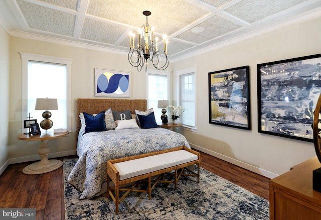 bedroom with a chandelier, ornamental molding, hardwood / wood-style flooring, and coffered ceiling