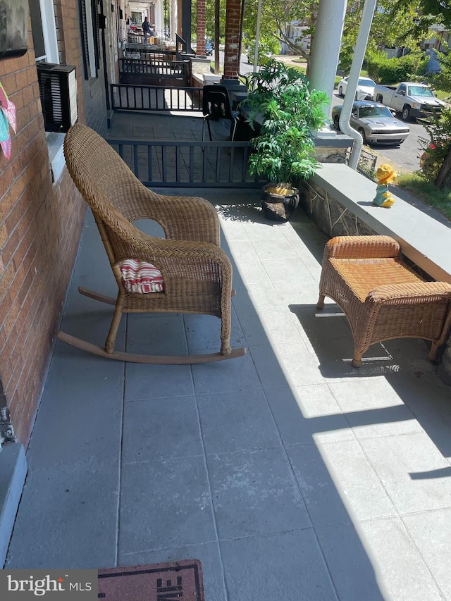 view of patio featuring a porch