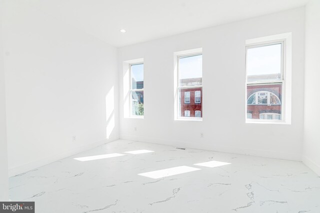 unfurnished room with a wealth of natural light