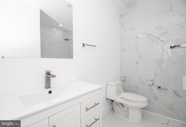 bathroom featuring vanity, toilet, and walk in shower