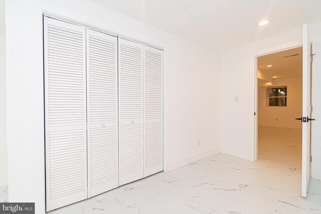 unfurnished bedroom with a closet