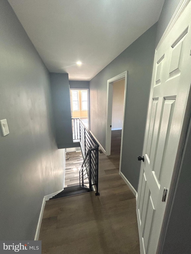 stairs featuring hardwood / wood-style flooring