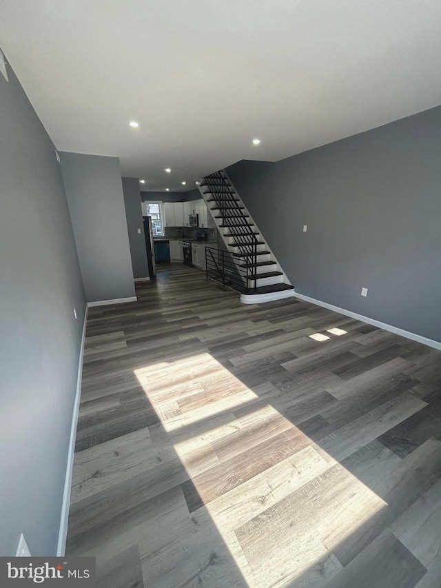 empty room featuring dark wood-type flooring