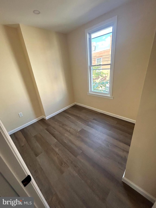 empty room featuring dark hardwood / wood-style floors