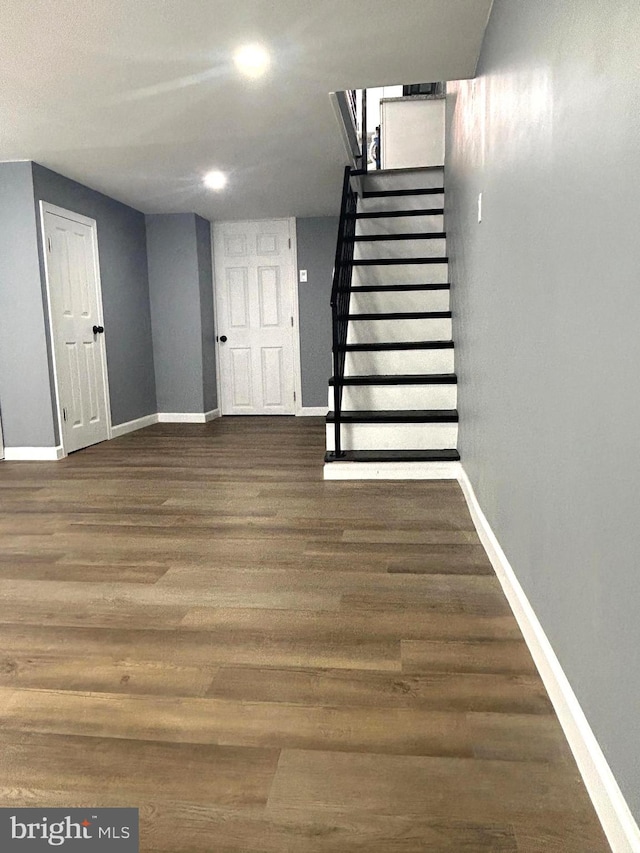 stairway with wood-type flooring