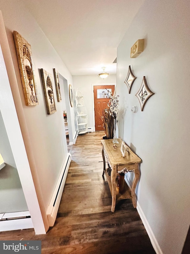 hallway with hardwood / wood-style flooring