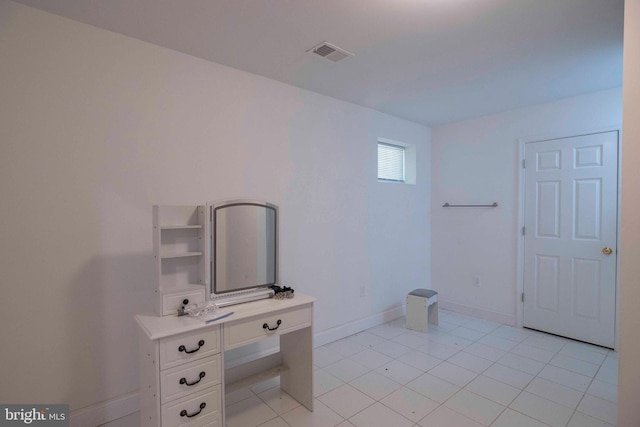 interior space featuring tile patterned flooring and vanity