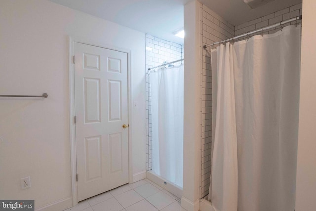 bathroom with tile patterned flooring and a shower with curtain