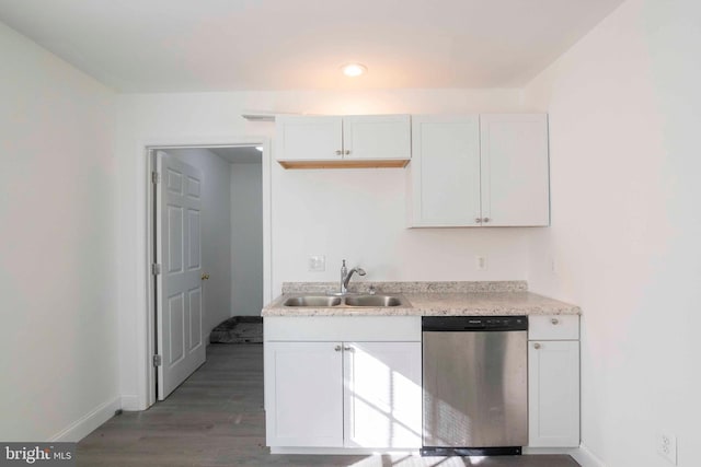 kitchen featuring dishwasher, dark hardwood / wood-style floors, white cabinetry, and sink