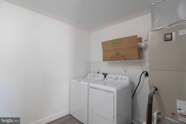 clothes washing area with washing machine and clothes dryer