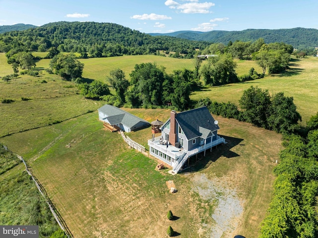 birds eye view of property featuring a mountain view and a rural view