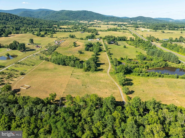 aerial view featuring a water and mountain view