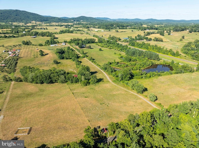 drone / aerial view with a rural view and a water and mountain view