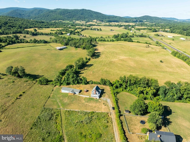 birds eye view of property featuring a mountain view and a rural view