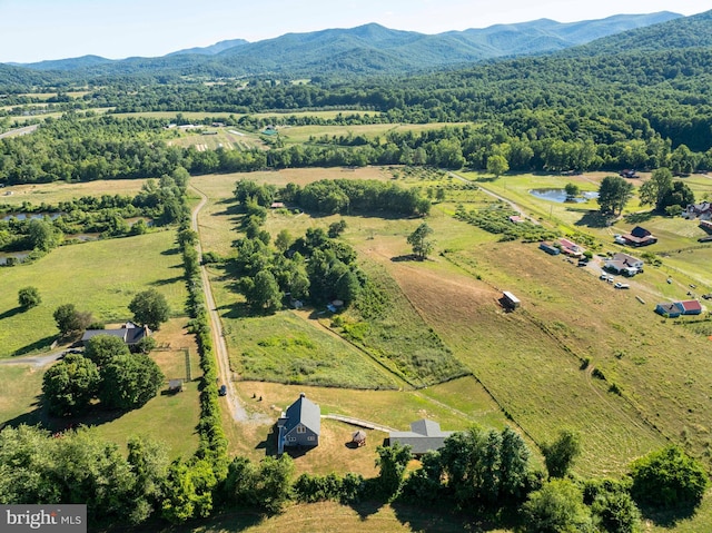 drone / aerial view with a mountain view and a rural view