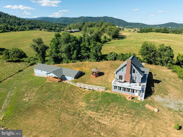 birds eye view of property featuring a mountain view and a rural view