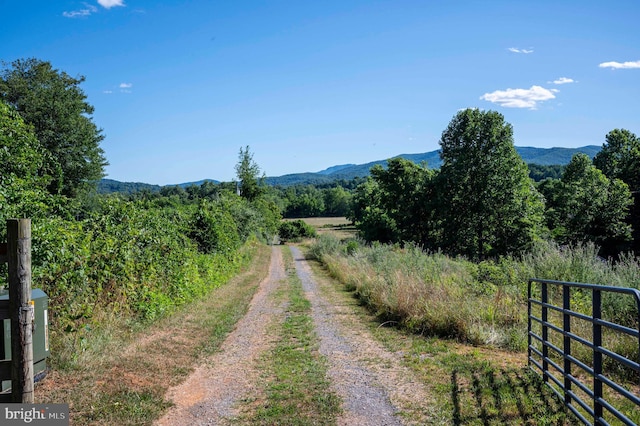 view of street featuring a mountain view and a rural view