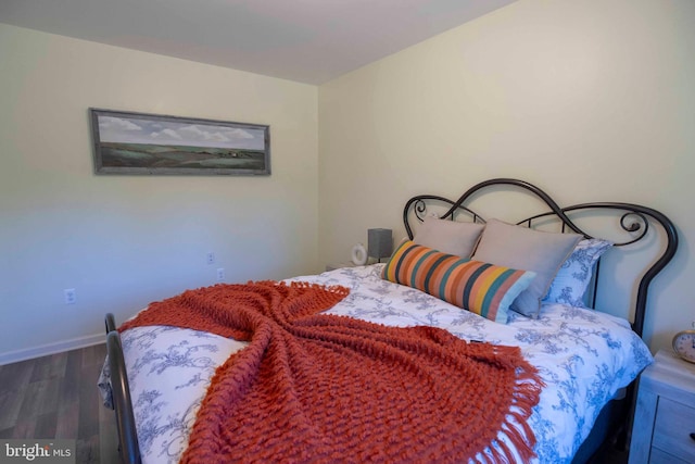 bedroom featuring dark wood-type flooring