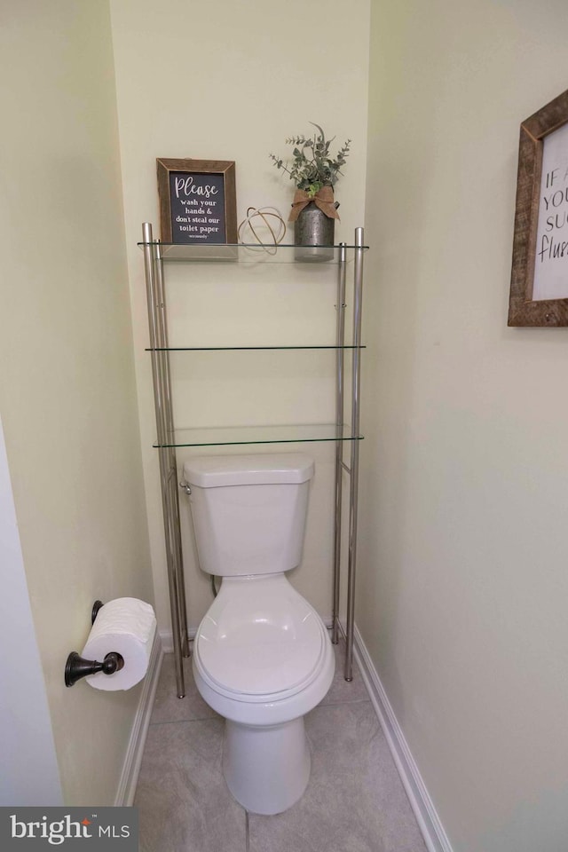 bathroom featuring tile patterned flooring and toilet