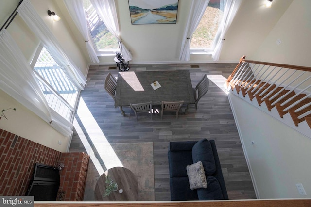 living room featuring a high ceiling and dark hardwood / wood-style floors