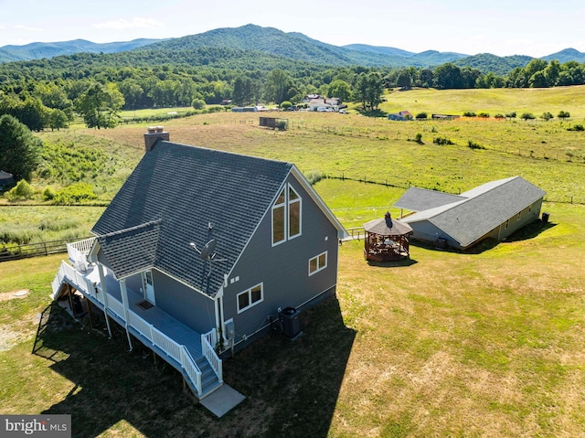 birds eye view of property with a mountain view and a rural view