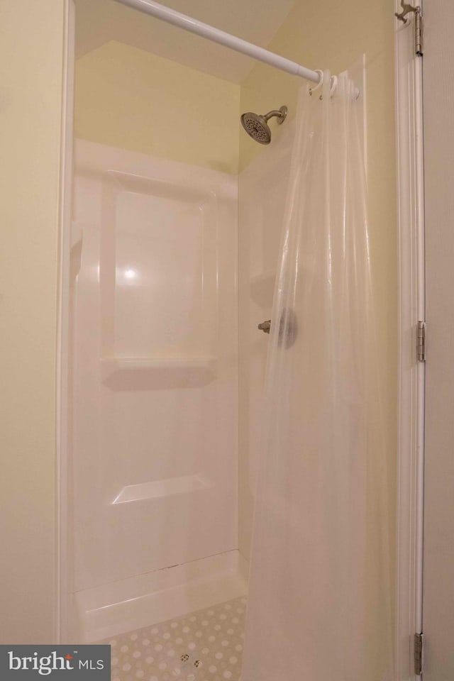 bathroom with a shower with shower curtain