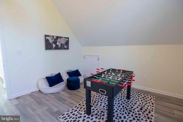 playroom with hardwood / wood-style flooring and vaulted ceiling