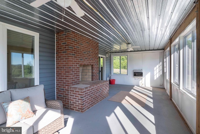 sunroom featuring heating unit