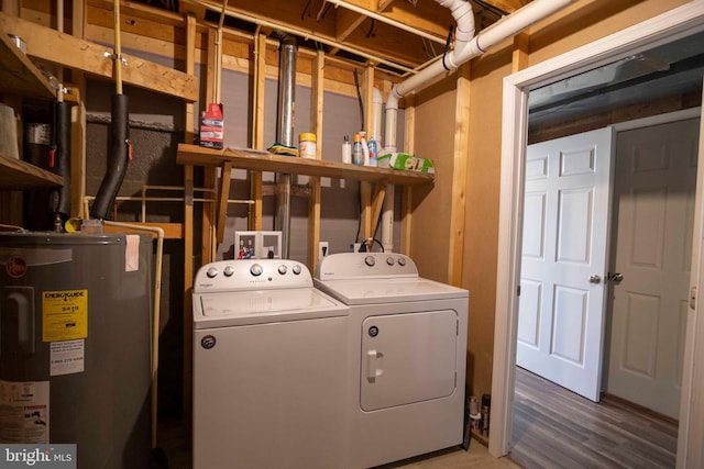 laundry area with independent washer and dryer and water heater