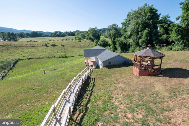 birds eye view of property with a rural view