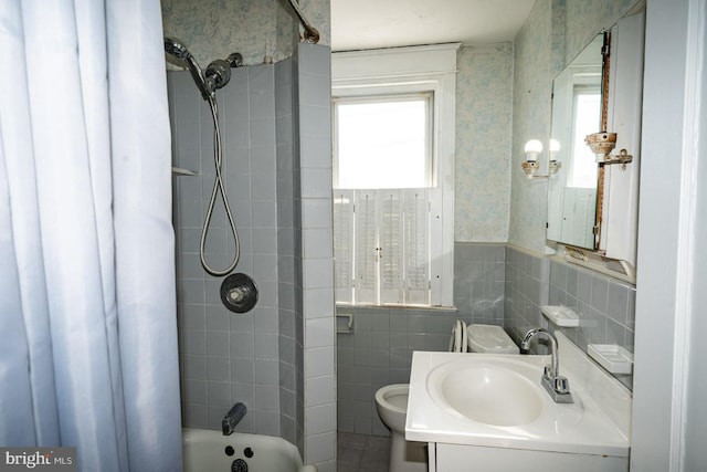 full bathroom featuring plenty of natural light, vanity, shower / tub combo, and toilet