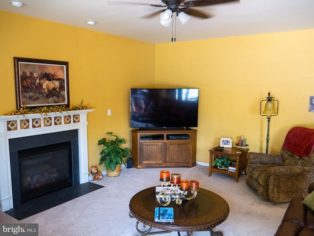 carpeted living room featuring ceiling fan