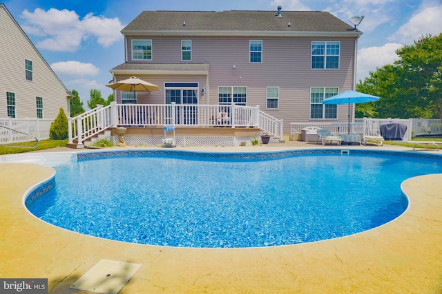 view of pool with a wooden deck