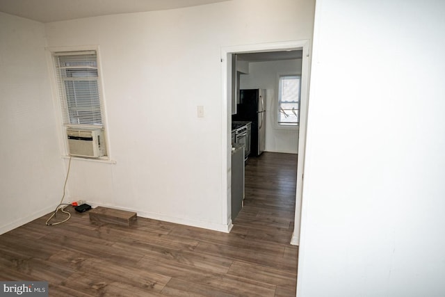 interior space featuring cooling unit and dark hardwood / wood-style floors