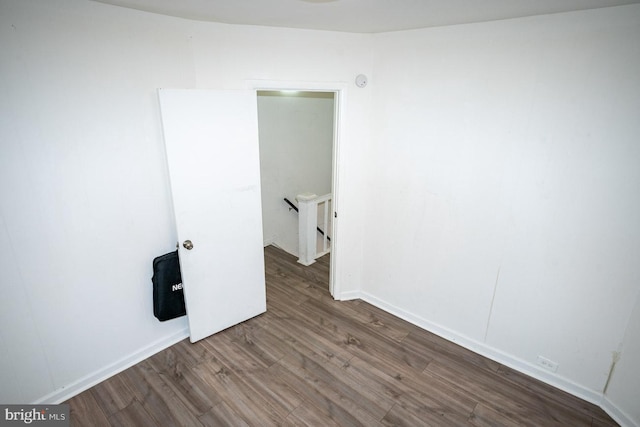 unfurnished room featuring hardwood / wood-style flooring