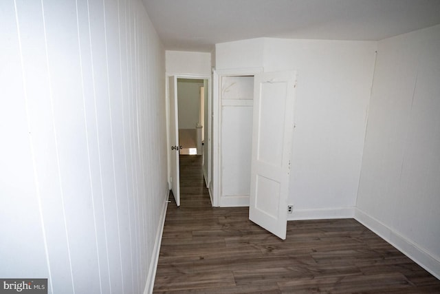 unfurnished bedroom featuring dark hardwood / wood-style flooring