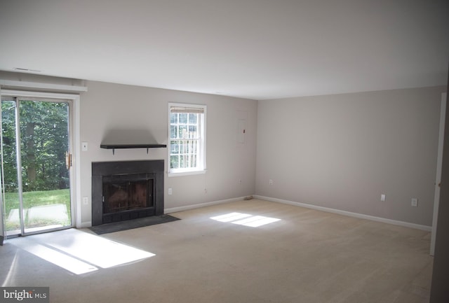 unfurnished living room with light carpet