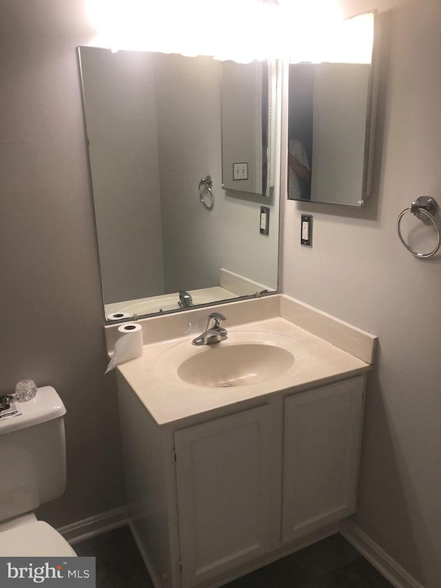 bathroom with vanity and toilet