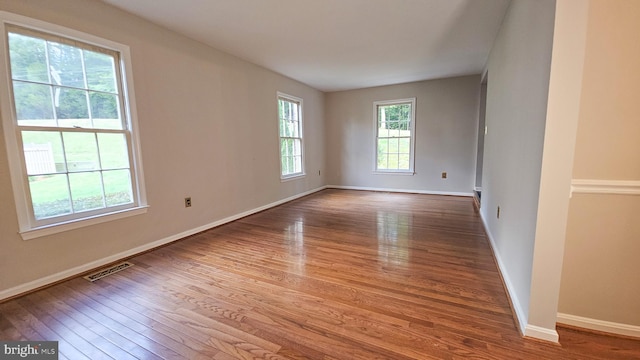 spare room featuring hardwood / wood-style floors