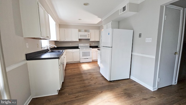 kitchen featuring dark hardwood / wood-style flooring, ornamental molding, white appliances, sink, and white cabinets