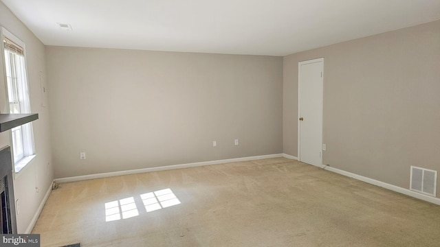 spare room with light carpet