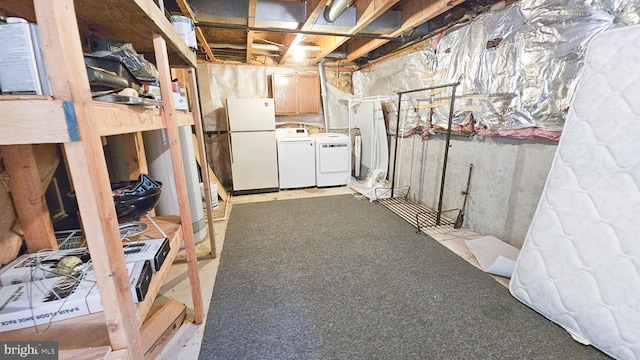 basement with washing machine and clothes dryer, light carpet, and white refrigerator