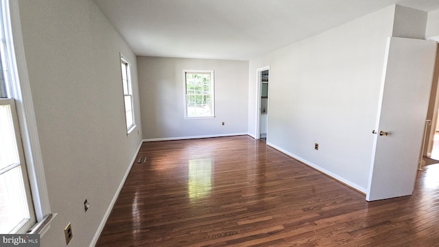 spare room featuring dark hardwood / wood-style floors