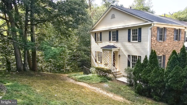 view of front of home with a front yard