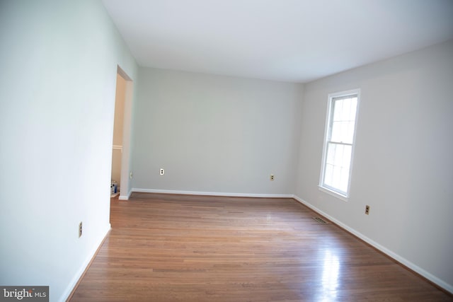 spare room featuring light hardwood / wood-style flooring