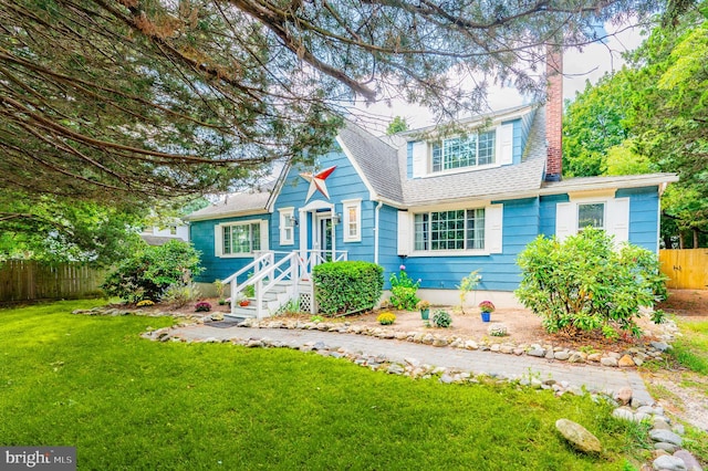 view of front of home with a front yard