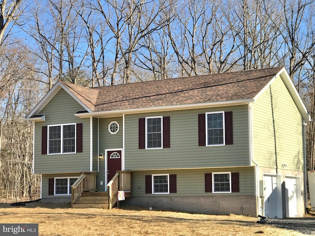 split foyer home featuring a garage