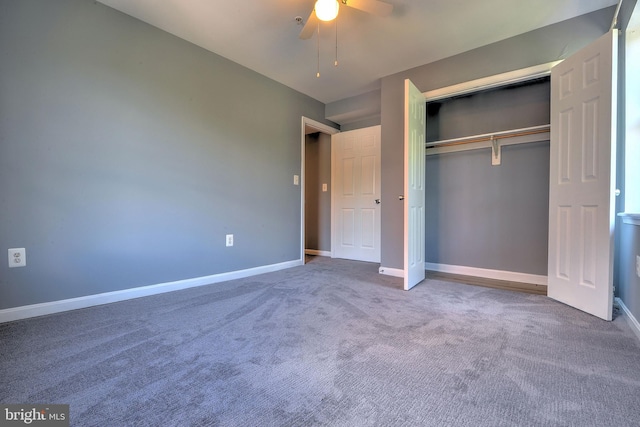 unfurnished bedroom with ceiling fan, a closet, and carpet floors