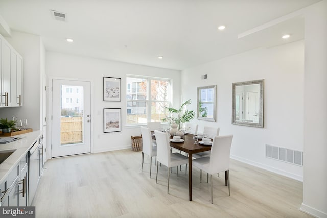 dining space featuring light hardwood / wood-style flooring